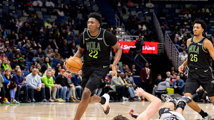 Dec 8, 2025; New Orleans, Louisiana, USA; New Orleans Pelicans center Derik Queen (22) brings the ball up court against San Antonio Spurs center/forward Luke Kornet (7) during the second half at Smoothie King Center. Mandatory Credit: Stephen Lew-Imagn Images Dec 8, 2025; New Orleans, Louisiana, USA; New Orleans Pelicans center Derik Queen (22) brings the ball up court against San Antonio Spurs center/forward Luke Kornet (7) during the second half at Smoothie King Center. Mandatory Credit: Stephen Lew-Imagn Images
