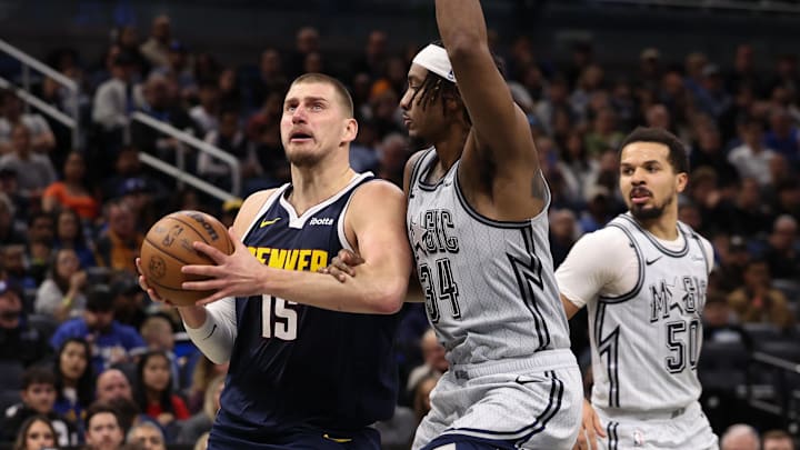 Jan 19, 2025; Orlando, Florida, USA; Denver Nuggets center Nikola Jokic (15) drives to the basket against the Orlando Magic in the second quarter at Kia Center. Mandatory Credit: Nathan Ray Seebeck-Imagn Images