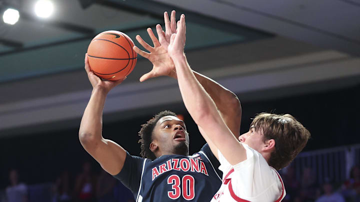 Nov 28, 2024; Paradise Island, Bahamas, BHS; Arizona Wildcats forward Tobe Awaka (30) shoots as Oklahoma Sooners forward Luke Northweather (45) defends during the first half in the Imperial Arena at the Atlantis Resort. Mandatory Credit: Kevin Jairaj-Imagn Images Nov 28, 2024; Paradise Island, Bahamas, BHS; Arizona Wildcats forward Tobe Awaka (30) shoots as Oklahoma Sooners forward Luke Northweather (45) defends during the first half in the Imperial Arena at the Atlantis Resort. Mandatory Credit: Kevin Jairaj-Imagn Images