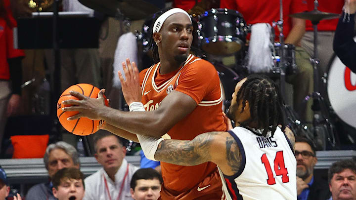 Jan 29, 2025; Oxford, Mississippi, USA; Texas Longhorns forward Arthur Kaluma (6) handles the ball as Mississippi Rebels guard Dre Davis (14) defends during the second half at The Sandy and John Black Pavilion at Ole Miss. Mandatory Credit: Petre Thomas-Imagn Images Jan 29, 2025; Oxford, Mississippi, USA; Texas Longhorns forward Arthur Kaluma (6) handles the ball as Mississippi Rebels guard Dre Davis (14) defends during the second half at The Sandy and John Black Pavilion at Ole Miss. Mandatory Credit: Petre Thomas-Imagn Images