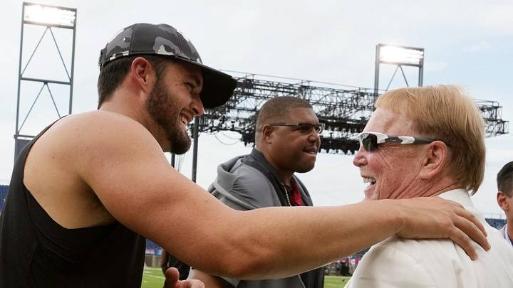 Aug 4, 2022; Canton, Ohio, USA; Las Vegas Raiders quarterback Derek Carr (4) talks with owner Mark Davis on the field before the NFL Hall of Fame game at Tom Benson Hall of Fame Stadium. Mandatory Credit: Kirby Lee-USA TODAY Sports Aug 4, 2022; Canton, Ohio, USA; Las Vegas Raiders quarterback Derek Carr (4) talks with owner Mark Davis on the field before the NFL Hall of Fame game at Tom Benson Hall of Fame Stadium. Mandatory Credit: Kirby Lee-USA TODAY Sports