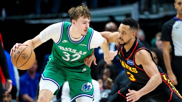 Mar 18, 2026; Dallas, Texas, USA; Dallas Mavericks forward Cooper Flagg (32) dribbles as Atlanta Hawks guard CJ McCollum (3) defends during the second half at American Airlines Center. Mandatory Credit: Kevin Jairaj-Imagn Images