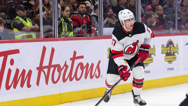 Oct 17, 2024; Ottawa, Ontario, CAN; New Jersey Devils defenseman Simon Nemec (17) skates with the puck in the first period against the Ottawa Senators at the Canadian Tire Centre. Mandatory Credit: Marc DesRosiers-Imagn Images