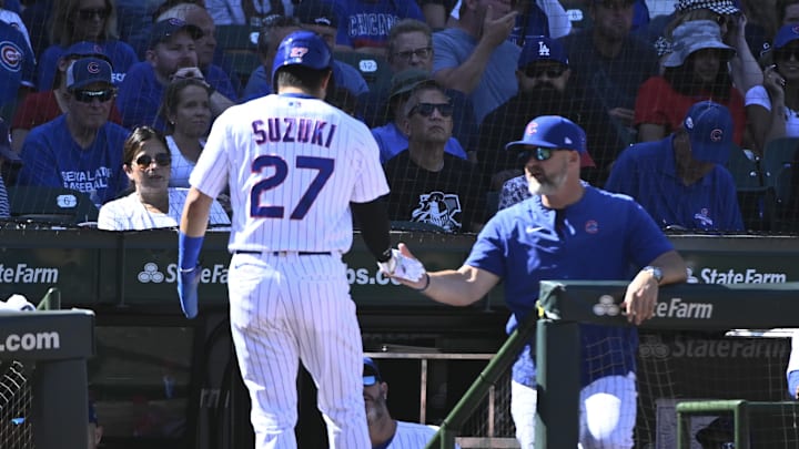 Sep 8, 2022; Chicago, Illinois, USA;  Chicago Cubs right fielder Seiya Suzuki (27) high fives