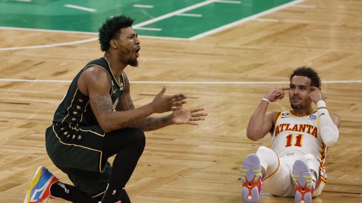 Apr 25, 2023; Boston, Massachusetts, USA; Atlanta Hawks guard Trae Young (11) points to his head after Boston Celtics guard Marcus Smart (36) was called for fouling him during the fourth quarter of game five of the 2023 NBA playoffs at TD Garden. Mandatory Credit: Winslow Townson-USA TODAY Sports Apr 25, 2023; Boston, Massachusetts, USA; Atlanta Hawks guard Trae Young (11) points to his head after Boston Celtics guard Marcus Smart (36) was called for fouling him during the fourth quarter of game five of the 2023 NBA playoffs at TD Garden. Mandatory Credit: Winslow Townson-USA TODAY Sports
