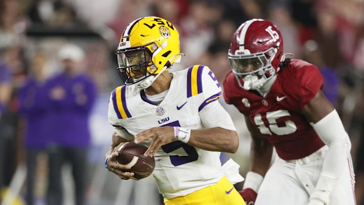 Nov 4, 2023; Tuscaloosa, Alabama, USA; LSU Tigers quarterback Jayden Daniels (5) carries the ball