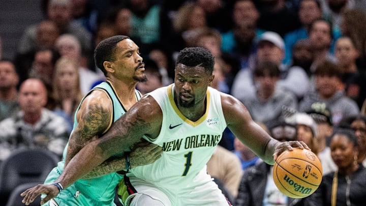 Jan 25, 2025; Charlotte, North Carolina, USA; New Orleans Pelicans forward Zion Williamson (1) controls the ball against Charlotte Hornets guard DaQuan Jeffries (3) during the second quarter at Spectrum Center. Mandatory Credit: Scott Kinser-Imagn Images