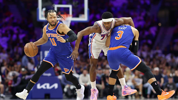 May 8, 2026; Philadelphia, Pennsylvania, USA; Philadelphia 76ers guard Vj Edgecombe (77) is fouled by New York Knicks guard Josh Hart (3) alongside guard Jalen Brunson (11) during the first quarter of game three of the second round of the 2026 NBA Playoffs at Xfinity Mobile Arena. Mandatory Credit: Bill Streicher-Imagn Images