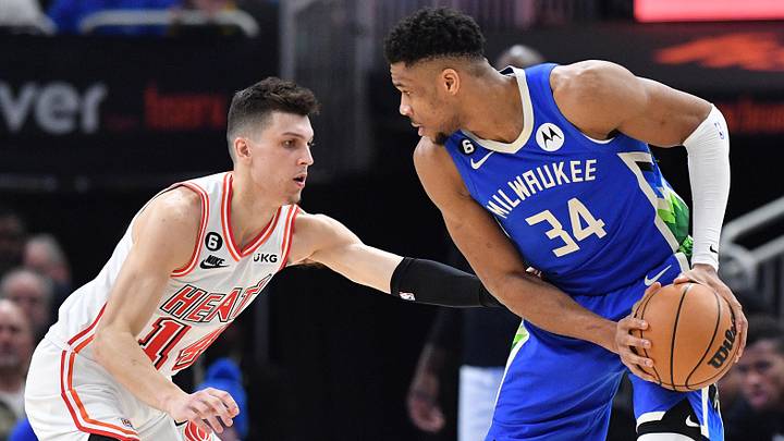 Feb 4, 2023; Milwaukee, Wisconsin, USA; Milwaukee Bucks forward Giannis Antetokounmpo (34) controls the ball against Miami Heat guard Tyler Herro (14) in the second half at Fiserv Forum. Mandatory Credit: Michael McLoone-Imagn Images