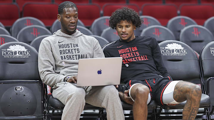 Apr 5, 2024; Houston, Texas, USA; Houston Rockets guard Jalen Green (right) talks with assistant coach Royal Ivey (left) before the game against the Miami Heat at Toyota Center. Mandatory Credit: Troy Taormina-Imagn Images