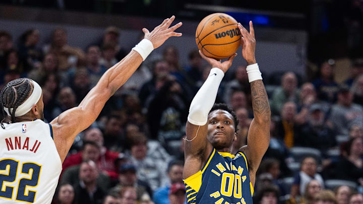 Feb 24, 2025; Indianapolis, Indiana, USA; Indiana Pacers guard Bennedict Mathurin (00) shoots the ball while Denver Nuggets forward Zeke Nnaji (22) defends in the first half at Gainbridge Fieldhouse. Mandatory Credit: Trevor Ruszkowski-Imagn Images Feb 24, 2025; Indianapolis, Indiana, USA; Indiana Pacers guard Bennedict Mathurin (00) shoots the ball while Denver Nuggets forward Zeke Nnaji (22) defends in the first half at Gainbridge Fieldhouse. Mandatory Credit: Trevor Ruszkowski-Imagn Images