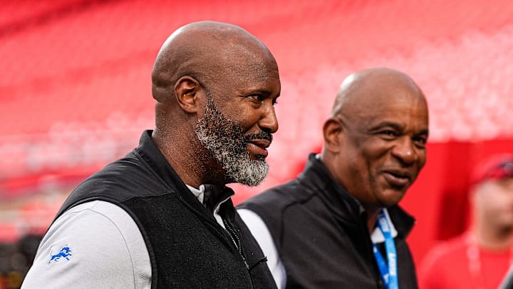 Detroit Lions general manager Brad Holmes, left, and assistant general manager Ray Agnew walk off the field during warm up at Arrowhead Stadium in Kansas City, Missouri on Sunday, Oct. 12, 2025.