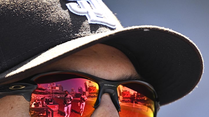 San Diego Padres right fielder David Peralta (24) and second baseman Jake Cronenworth (9) are seen in a reflection on the glasses worn by first base coach David Macias (46) during the fifth inning against the Chicago White Sox at Petco Par on Sept 2. San Diego Padres right fielder David Peralta (24) and second baseman Jake Cronenworth (9) are seen in a reflection on the glasses worn by first base coach David Macias (46) during the fifth inning against the Chicago White Sox at Petco Par on Sept 2.
