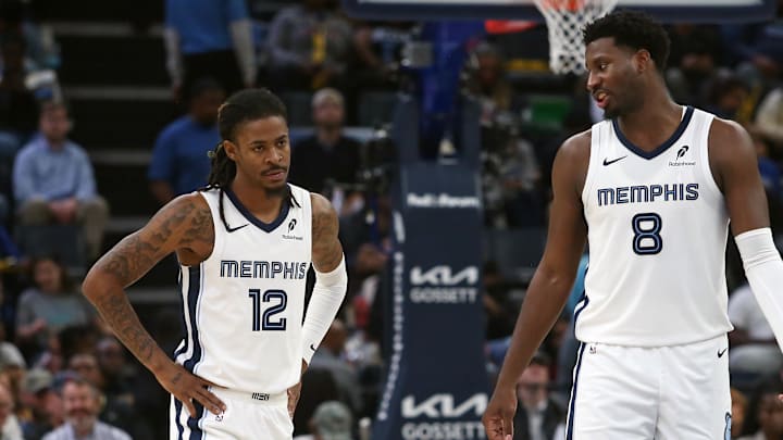 Nov 5, 2025; Memphis, Tennessee, USA; Memphis Grizzlies forward/center Jaren Jackson Jr. (8) talks with guard Ja Morant (12) during the second quarter against the Houston Rockets at FedExForum. Mandatory Credit: Petre Thomas-Imagn Images