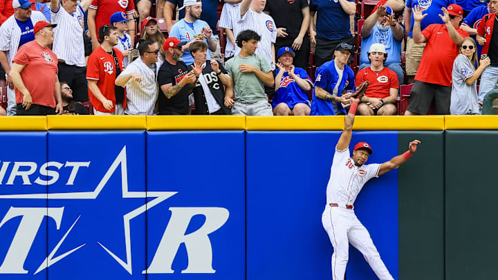 May 25, 2025; Cincinnati, Ohio, USA; Cincinnati Reds outfielder Will Benson (30) attempts to catch a solo home run hit by Chicago Cubs catcher Reese McGuire (20) in the second inning at Great American Ball Park. Mandatory Credit: Katie Stratman-Imagn Images