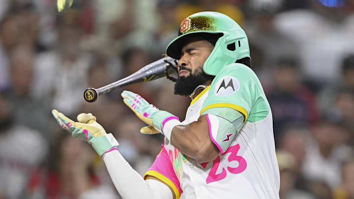 Aug 8, 2025; San Diego, California, USA; San Diego Padres right fielder Fernando Tatis Jr. (23) dodges a pitch during the eighth inning against the Boston Red Sox at Petco Park. Mandatory Credit: Denis Poroy-Imagn Images