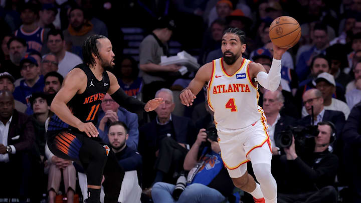 Apr 28, 2026; New York, New York, USA; Atlanta Hawks guard Gabe Vincent (4) looks to pass the ball against New York Knicks guard Jalen Brunson (11) during the second quarter of game five of the first round of the 2026 NBA Playoffs at Madison Square Garden. Mandatory Credit: Brad Penner-Imagn Images