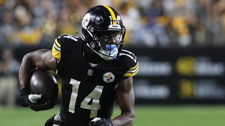 Oct 6, 2024; Pittsburgh, Pennsylvania, USA;  Pittsburgh Steelers wide receiver George Pickens (14) runs after a catch against the Dallas Cowboys during the fourth quarter at Acrisure Stadium. Dallas won 20-17. Mandatory Credit: Charles LeClaire-Imagn Images