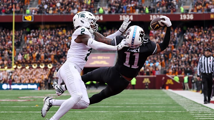 Nov 1, 2025; Minneapolis, Minnesota, USA; Minnesota Golden Gophers wide receiver Javon Tracy (11) attempts to catch a pass as Michigan State Spartans defensive back Aydan West (2) defends during the first half at Huntington Bank Stadium. Mandatory Credit: Matt Krohn-Imagn Images