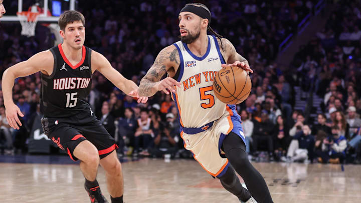 Feb 21, 2026; New York, New York, USA;  New York Knicks guard Jose Alvarado (5) looks to drive past Houston Rockets guard Reed Sheppard (15) in the fourth quarter at Madison Square Garden. Mandatory Credit: Wendell Cruz-Imagn Images