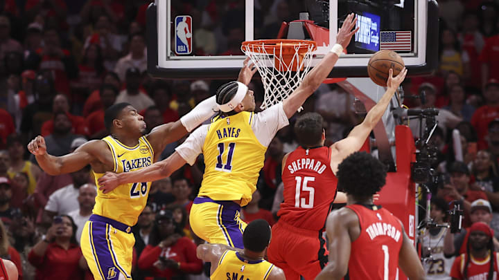 Apr 24, 2026; Houston, Texas, USA; Los Angeles Lakers center/forward Jaxson Hayes (11) defends against Houston Rockets guard Reed Sheppard (15) during the fourth quarter during game three of the first round of the 2026 NBA Playoffs at Toyota Center. Mandatory Credit: Troy Taormina-Imagn Images