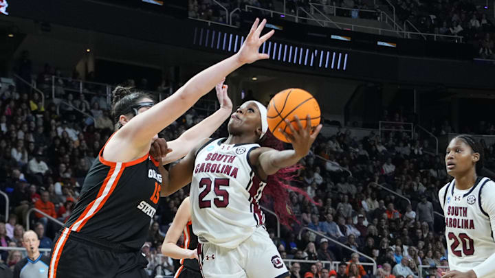 Mar 31, 2024; Albany, NY, USA; South Carolina Gamecocks guard Raven Johnson (25) shoots a layup against Oregon State Beavers forward Raegan Beers (15) during the second half in the finals of the Albany Regional of the 2024 NCAA Tournament at MVP Arena. Mandatory Credit: Gregory Fisher-Imagn Images