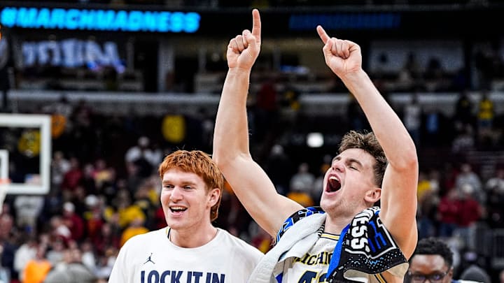 Michigan forward Will Tschetter (42), right, and forward Oscar Goodman (5) celebrate 90-77 win over Alabama at the NCAA Tournament Sweet 16 round at United Center in Chicago on Friday, March 27, 2026.