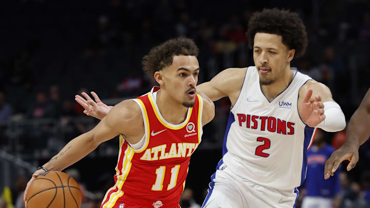 Mar 23, 2022; Detroit, Michigan, USA; Atlanta Hawks guard Trae Young and Detroit Pistons Cade Cunningham