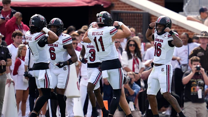 South Carolina Gamecocks quarterback LaNorris Sellers (16) celebrates with quarterback Davis Beville (11) after a touchdown during a college football game between the University of Oklahoma Sooners (OU) and the South Carolina Gamecocks at Gaylord Family - Oklahoma Memorial Stadium in Norman, Okla., Saturday, Oct. 19, 2024. South Carolina Gamecocks quarterback LaNorris Sellers (16) celebrates with quarterback Davis Beville (11) after a touchdown during a college football game between the University of Oklahoma Sooners (OU) and the South Carolina Gamecocks at Gaylord Family - Oklahoma Memorial Stadium in Norman, Okla., Saturday, Oct. 19, 2024.