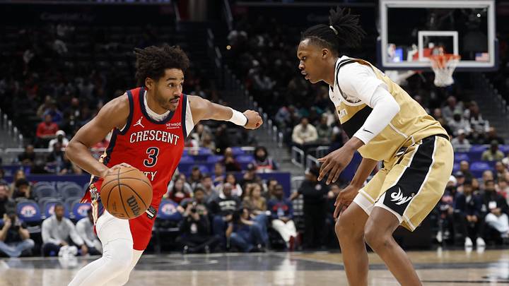 Jan 9, 2026; Washington, District of Columbia, USA; New Orleans Pelicans guard Jordan Poole (3) drives to the basket as Washington Wizards guard Bub Carrington (7) defends in the first half at Capital One Arena. Mandatory Credit: Geoff Burke-Imagn Images
