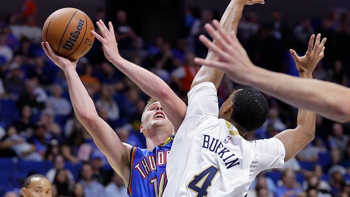 Oct 6, 2026; Tulsa, Oklahoma, USA; Oklahoma City Thunder guard Bennett Stirtz (14) shoots as New Orleans Pelicans guard Kobe Bufkin (4) defends during the second half at BOK Center. Oct 6, 2026; Tulsa, Oklahoma, USA; Oklahoma City Thunder guard Bennett Stirtz (14) shoots as New Orleans Pelicans guard Kobe Bufkin (4) defends during the second half at BOK Center.