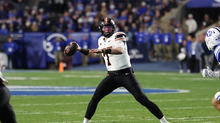 Oct 18, 2024; Provo, Utah, USA; Oklahoma State Cowboys quarterback Alan Bowman (7) passes the ball against the Brigham Young Cougars during the second quarter at LaVell Edwards Stadium. Mandatory Credit: Rob Gray-Imagn Images