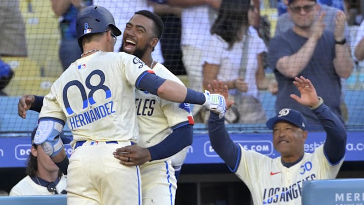 Dodgers third baseman Enrique Hernandez (8) celebrates with right fielder Teoscar Hernandez (37) after hitting a two-run home run in the seventh inning against the Boston Red Sox at Dodger Stadium on July 20, 2024.