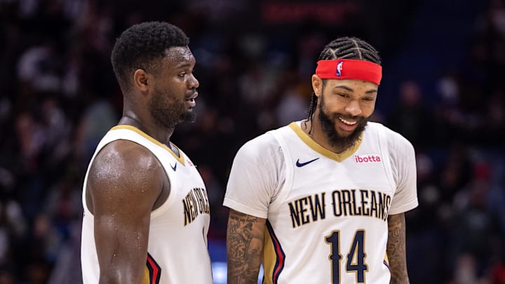 Dec 31, 2023; New Orleans, Louisiana, USA;  New Orleans Pelicans forward Zion Williamson (1) and forward Brandon Ingram (14) share a laugh after a play against the Los Angeles Lakers during the second half at Smoothie King Center. Mandatory Credit: Stephen Lew-Imagn Images