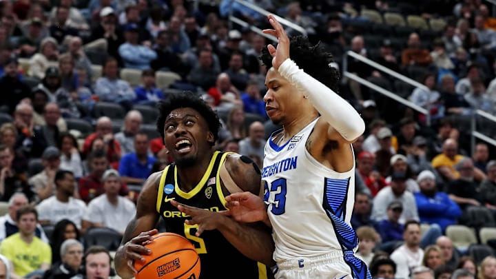 Mar 23, 2024; Pittsburgh, PA, USA; Oregon Ducks guard Jermaine Couisnard (5) drives to the basket