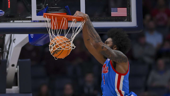 Mar 13, 2026; Nashville, TN, USA;  Mississippi Rebels forward James Scott (4) dunks the ball against the Alabama Crimson Tideduring the first half at Bridgestone Arena. Mandatory Credit: Steve Roberts-Imagn Images