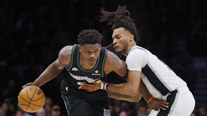 May 10, 2026; Minneapolis, Minnesota, USA; Minnesota Timberwolves guard Anthony Edwards (5) works around San Antonio Spurs guard Stephon Castle (5) in the fourth quarter of game four of the second round of the 2026 NBA Playoffs at Target Center. Mandatory Credit: Bruce Kluckhohn-Imagn Images