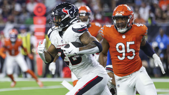 Sep 15, 2024; Houston, Texas, USA; Houston Texans running back Joe Mixon (28) runs with the ball during the third quarter against the Chicago Bears at NRG Stadium. Mandatory Credit: Troy Taormina-Imagn Images
