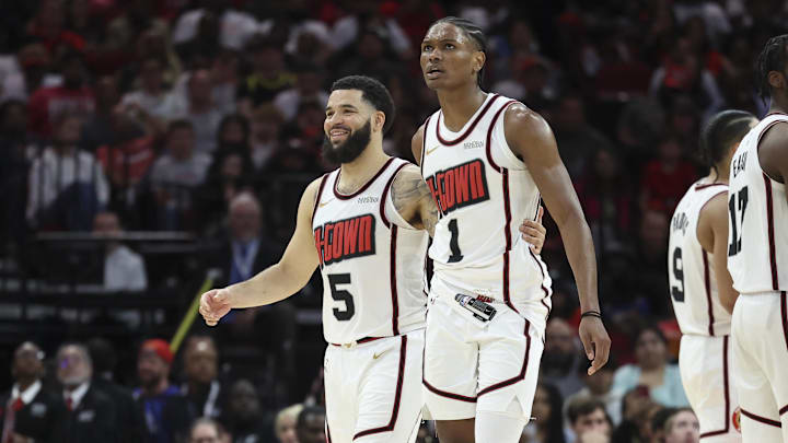 Mar 23, 2025; Houston, Texas, USA; Houston Rockets guard Fred VanVleet (5) and forward Amen Thompson (1) react after a play during the third quarter against the Denver Nuggets at Toyota Center. Mandatory Credit: Troy Taormina-Imagn Images
