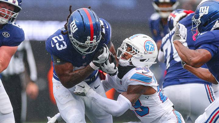 Sep 27, 2026; East Rutherford, New Jersey, USA; New York Giants running back Najee Harris (23) is tackled by Tennessee Titans safety Kevin Winston Jr. (23) during the first half at MetLife Stadium. Sep 27, 2026; East Rutherford, New Jersey, USA; New York Giants running back Najee Harris (23) is tackled by Tennessee Titans safety Kevin Winston Jr. (23) during the first half at MetLife Stadium.