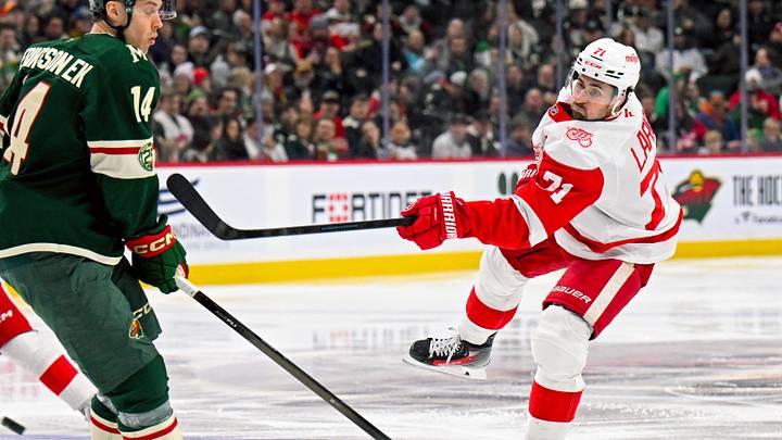 Jan 22, 2026; Saint Paul, Minnesota, USA;  Detroit Red Wings forward Dylan Larkin (71) shoots against the Minnesota Wild during the third period at Grand Casino Arena. Mandatory Credit: Nick Wosika-Imagn Images