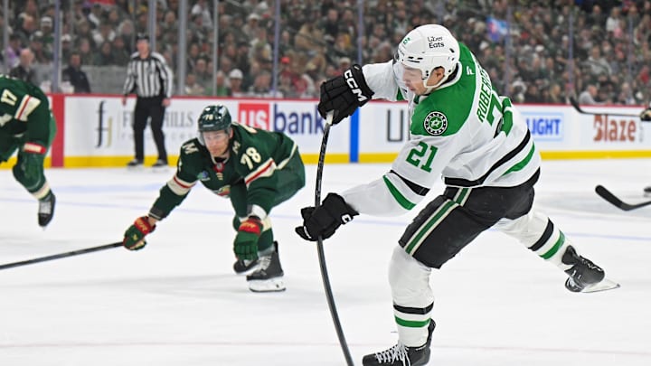 Apr 25, 2026; Saint Paul, Minnesota, USA; Dallas Stars forward Jason Robertson (21) shoots the puck against the Minnesota Wild during the first period in game four of the first round of the 2026 Stanley Cup Playoffs at Grand Casino Arena. Mandatory Credit: Nick Wosika-Imagn Images