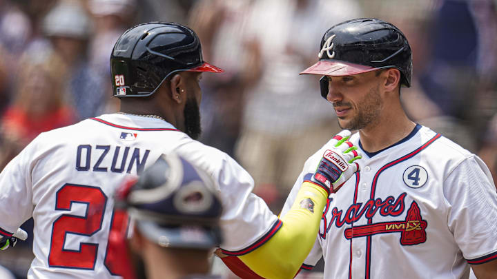 Jun 1, 2025; Cumberland, Georgia, USA; Atlanta Braves designated hitter Marcell Ozuna (20) reacts with first baseman Matt Olson (28) after hitting a home run against the Boston Red Sox during the first inning at Truist Park. Mandatory Credit: Dale Zanine-Imagn Images