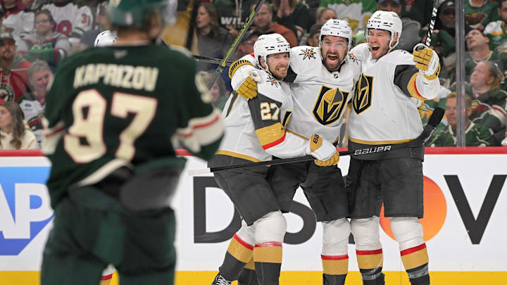 May 1, 2025; Saint Paul, Minnesota, USA;  Vegas Golden Knights forward Mark Stone (61) celebrates his goal against the Minnesota Wild with defenseman Brayden McNabb (3) and defenseman Shea Theodore (27) during the third period in game six of the first round of the 2025 Stanley Cup Playoffs at Xcel Energy Center. Mandatory Credit: Nick Wosika-Imagn Images