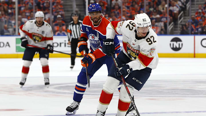 Jun 6, 2025; Edmonton, Alberta, CAN; Florida Panthers left wing Tomas Nosek (92) skates with the puck past Edmonton Oilers left wing Evander Kane (91) during the first period in game two of the 2025 Stanley Cup Final at Rogers Place. Mandatory Credit: Perry Nelson-Imagn Images