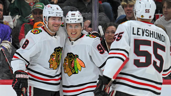 Sep 28, 2025; Saint Paul, Minnesota, USA;  Chicago Blackhawks forward Ryan Donato (8) celebrates his goal against the Minnesota Wild with forward Connor Bedard (98) and defensemen Artyom Levshunov (55) during the third period at Xcel Energy Center. Mandatory Credit: Nick Wosika-Imagn Images
