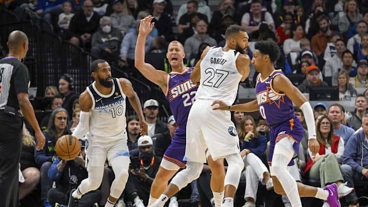Minnesota Timberwolves center Rudy Gobert (27) sets a pick on Phoenix Suns center Mason Plumlee for guard Mike Conley as forward Ryan Dunn gives chase during the first quarter at Target Center in Minneapolis on Nov. 17, 2024.