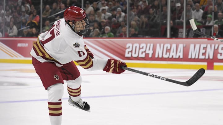 Apr 13, 2024; Saint Paul, Minnesota, USA; Boston College Eagles defenseman Aram Minnetian (17) takes a shot on goal against the Denver Pioneers during the first period of the championship game of the 2024 Frozen Four college ice hockey tournament at Xcel Energy Center. Mandatory Credit: Nick Wosika-Imagn Images