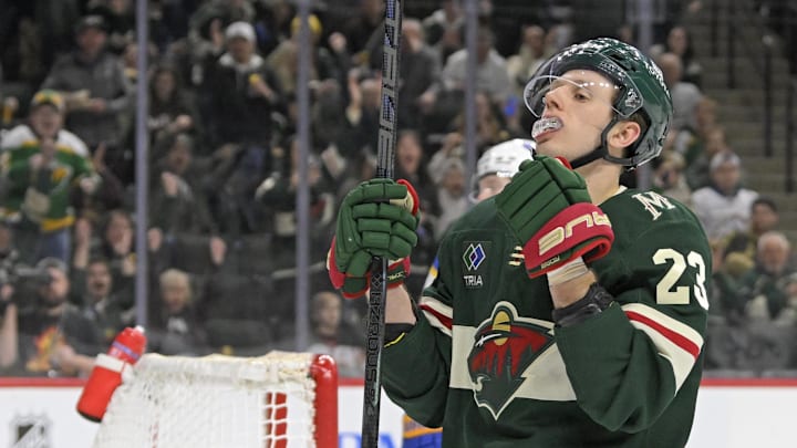 Mar 22, 2025; Saint Paul, Minnesota, USA;  Minnesota Wild forward Marco Rossi (23) celebrates his goal against the Buffalo Sabres during the second period at Xcel Energy Center. Mandatory Credit: Nick Wosika-Imagn Images