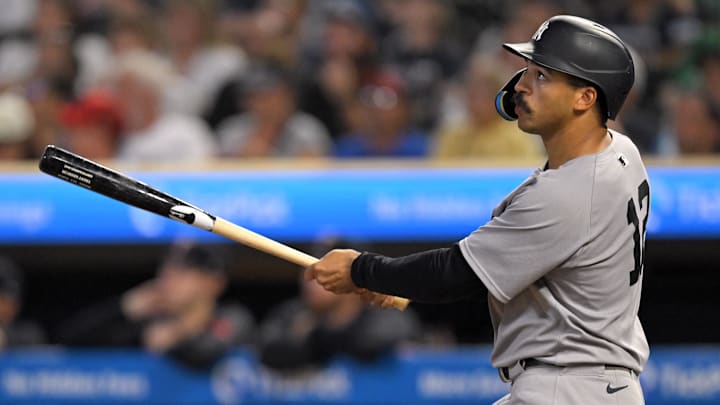 Sep 17, 2025; Minneapolis, Minnesota, USA;  New York Yankees outfielder Trent Grisham (12) flies out against the Minnesota Twins during the sixth inning at Target Field. Mandatory Credit: Nick Wosika-Imagn Images

